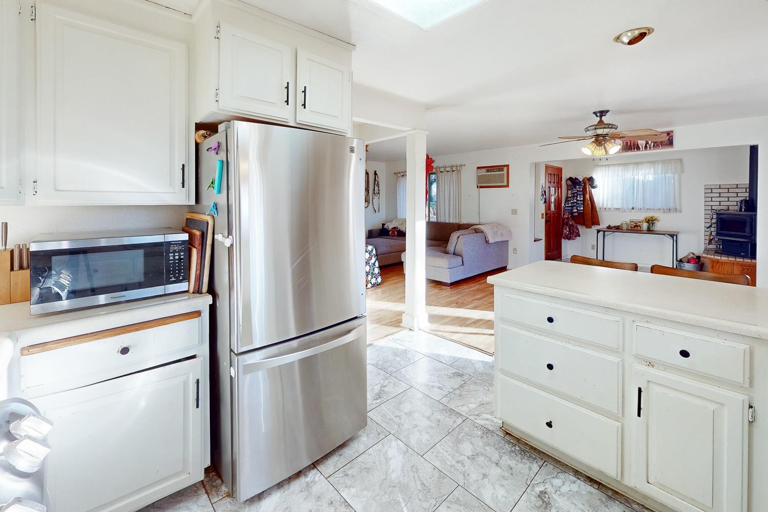 10095 Frenchtown Dobbins Road Dobbins, CA 95935 - Photo 11 of 46 a kitchen with cabinets stainless steel appliances and a refrigerator