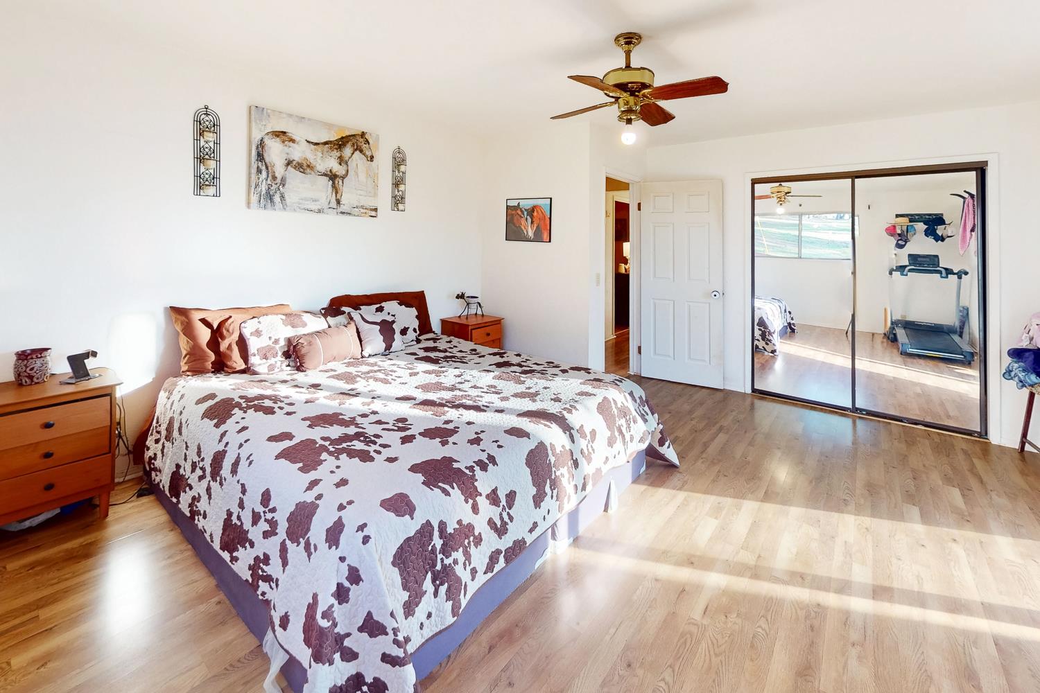 10095 Frenchtown Dobbins Road Dobbins, CA 95935 - Photo 17 of 46 a bedroom with a large bed and a chandelier