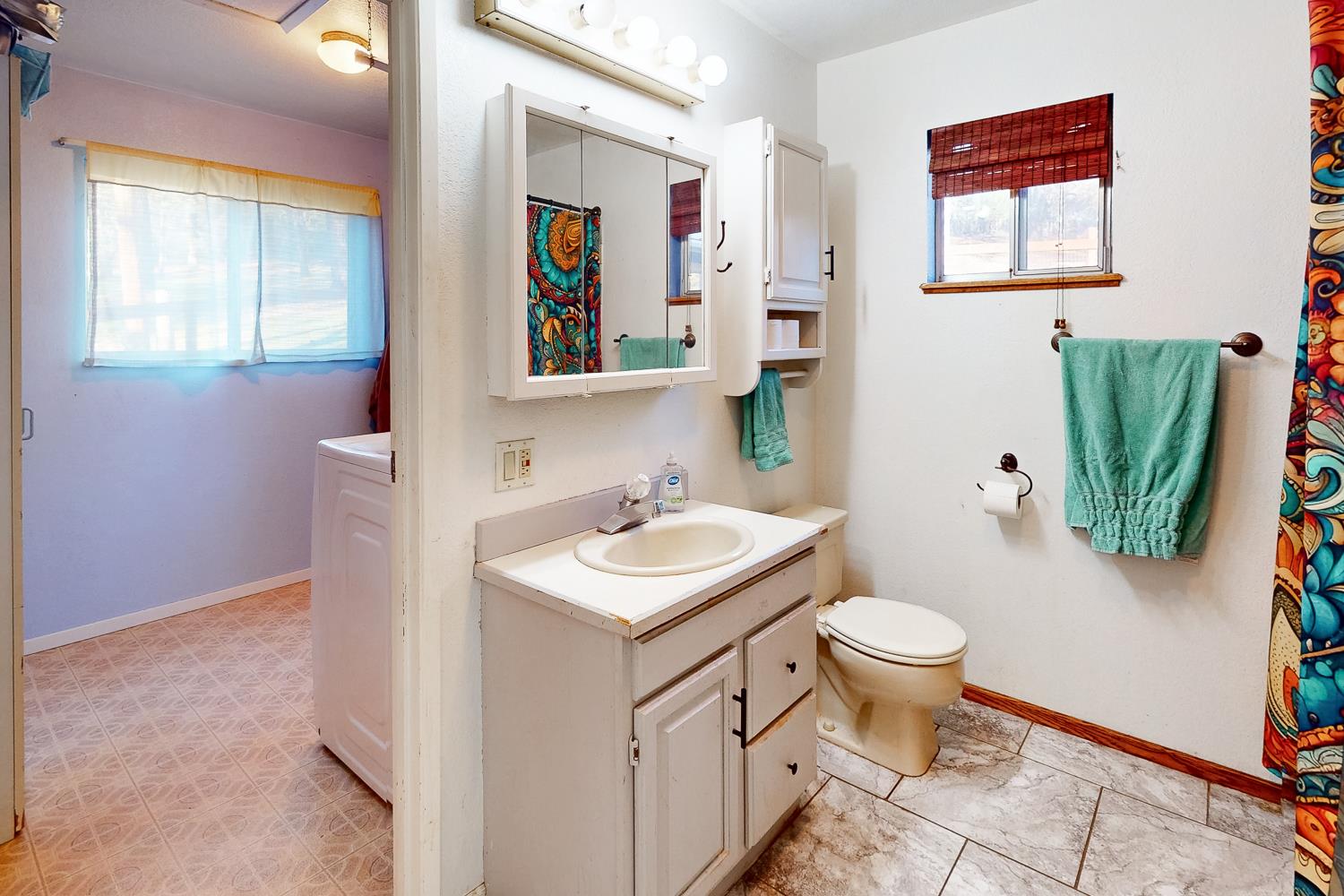 10095 Frenchtown Dobbins Road Dobbins, CA 95935 - Photo 18 of 46 a bathroom with a toilet sink and mirror