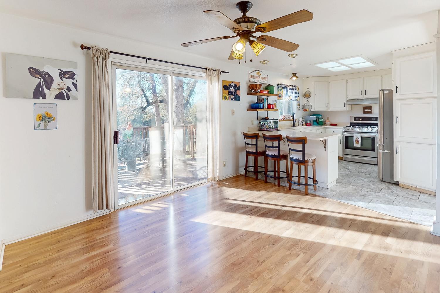 10095 Frenchtown Dobbins Road Dobbins, CA 95935 - Photo 3 of 46 a view of a livingroom with furniture wooden floor and a ceiling fan