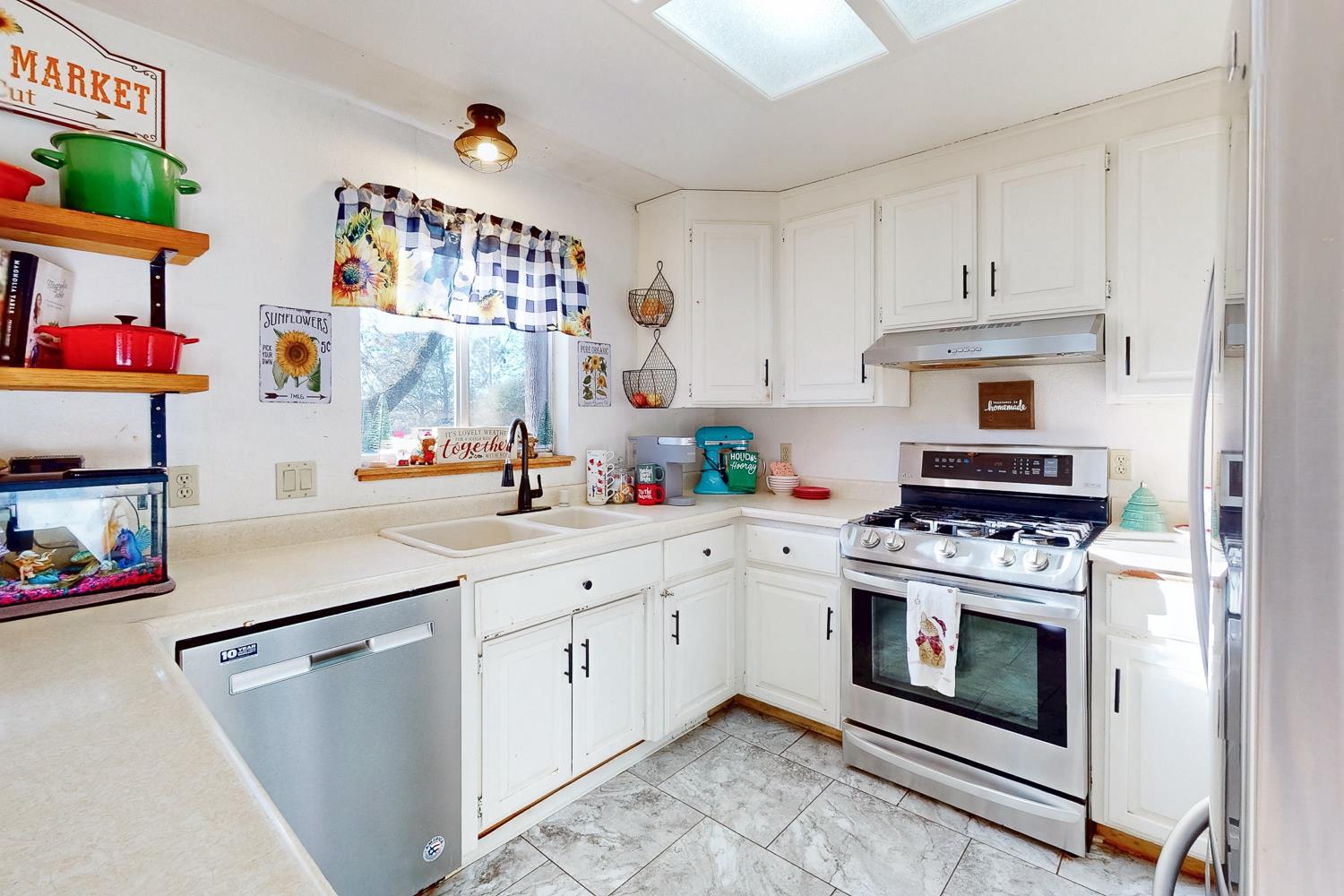 10095 Frenchtown Dobbins Road Dobbins, CA 95935 - Photo 10 of 46 a kitchen with stainless steel appliances granite countertop a stove and white cabinets