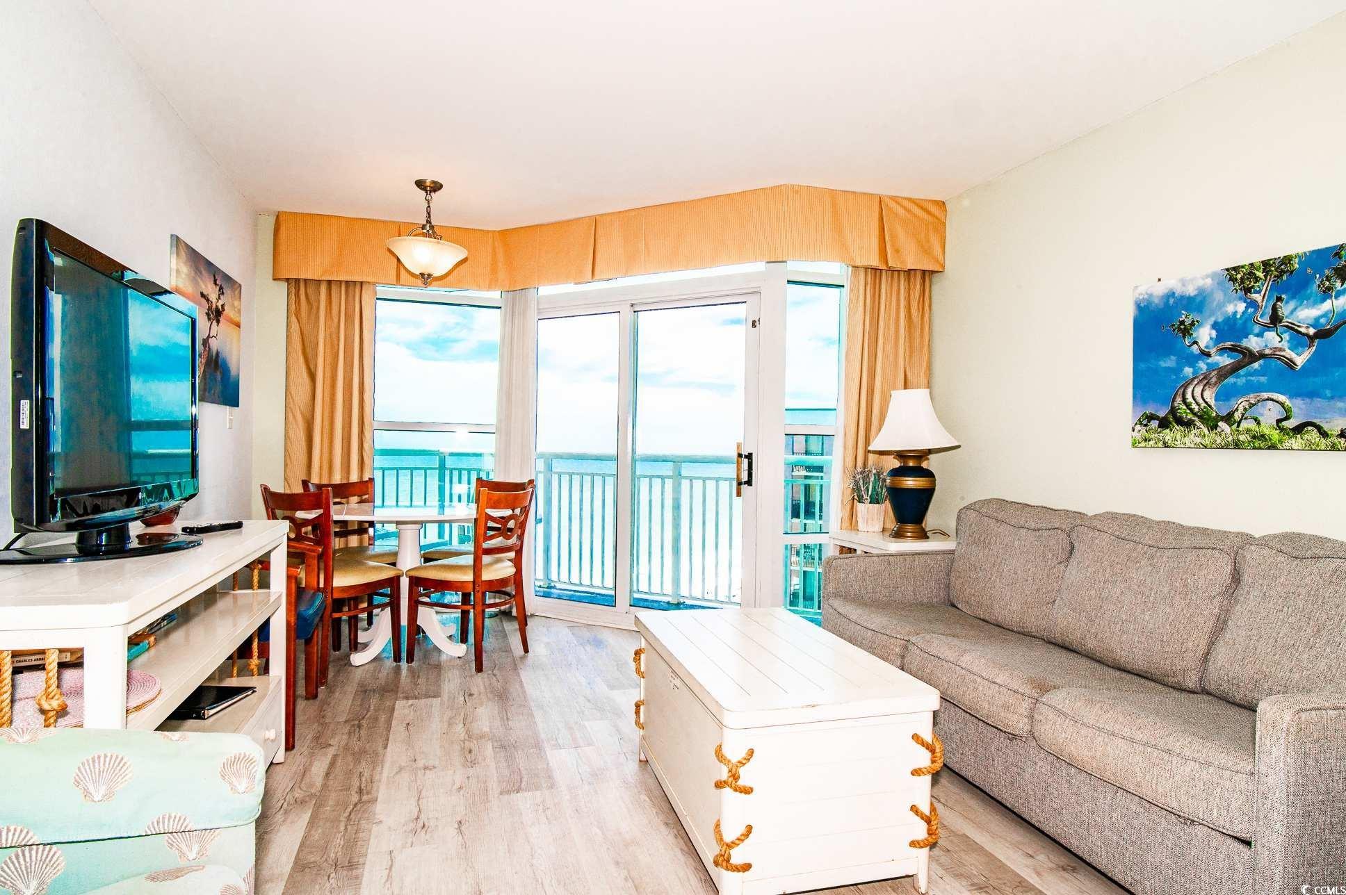 2504 North Ocean Boulevard, Unit 1835 Myrtle Beach, SC 29577 - Photo 4 of 25 Living room featuring light wood-style flooring and a water view