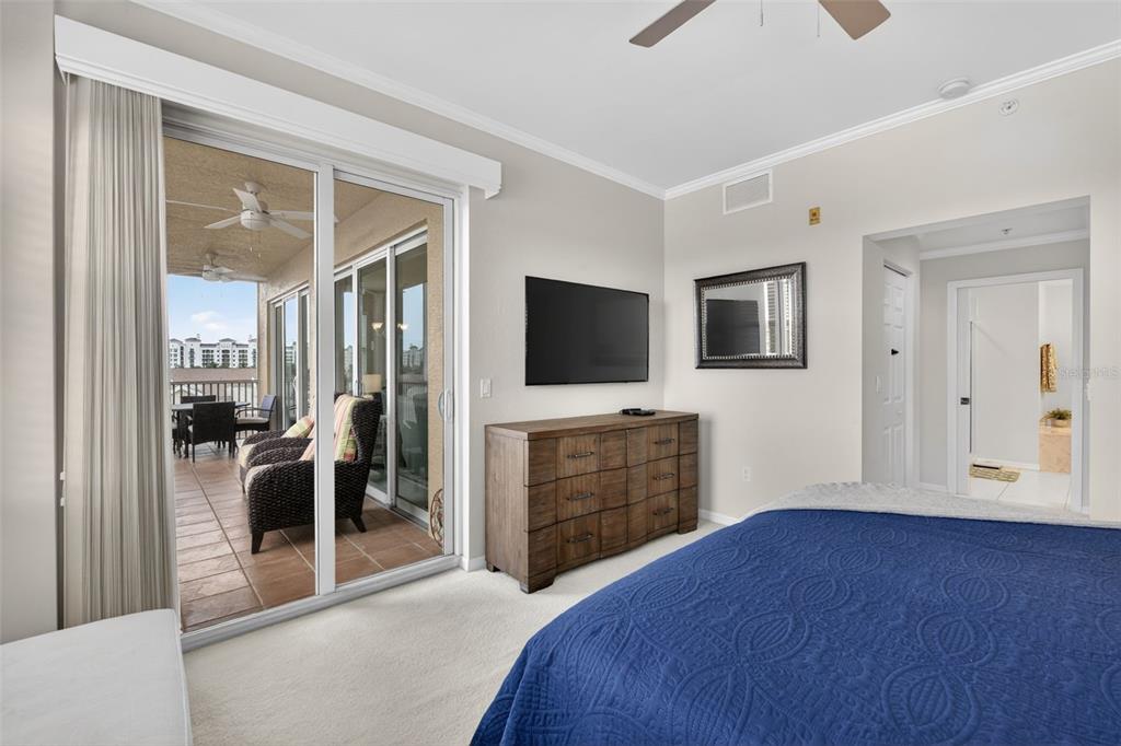 2060 Matecumbe Key Road, Unit 2506 Punta Gorda, FL 33955 - Photo 17 of 38 a bedroom with a bed and a flat screen tv