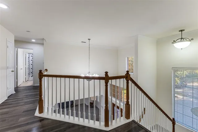 a view of hallway with wooden floor