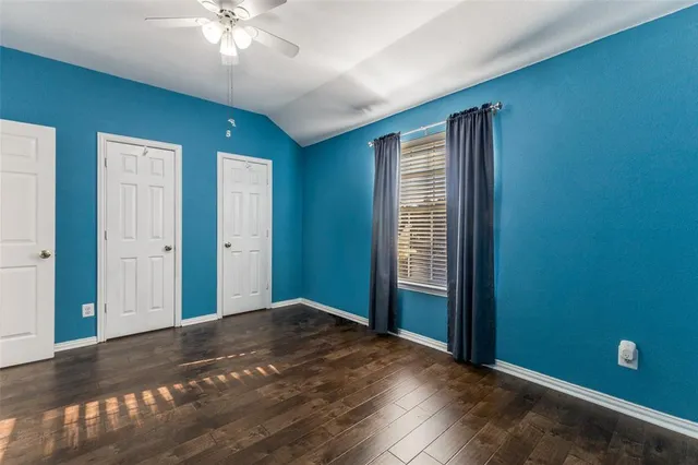 a view of a livingroom with a chandelier fan
