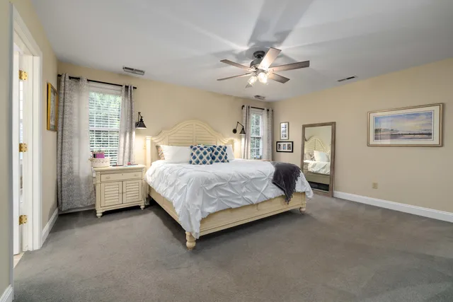 an aerial view of a house with a garden and trees