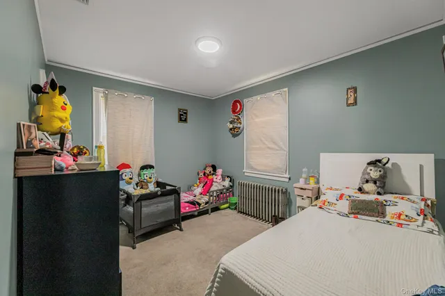 a bedroom with bed and window