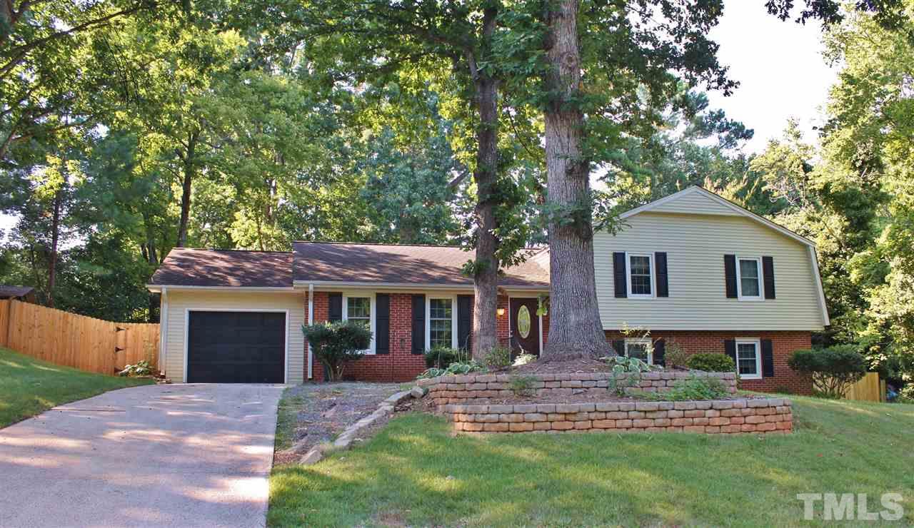 4004 Grimstead Lane Raleigh, NC 27613 - Photo 1 of 25 a front view of a house with a garden and yard