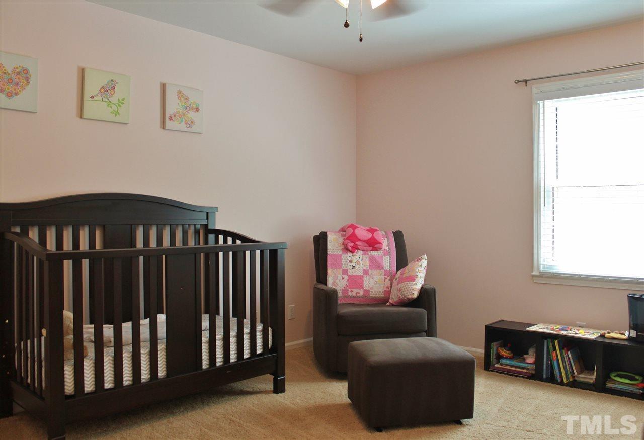 4004 Grimstead Lane Raleigh, NC 27613 - Photo 14 of 25 a bedroom with furniture and a window