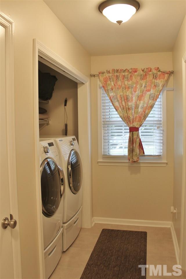 4004 Grimstead Lane Raleigh, NC 27613 - Photo 21 of 25 a utility room with dryer and washer