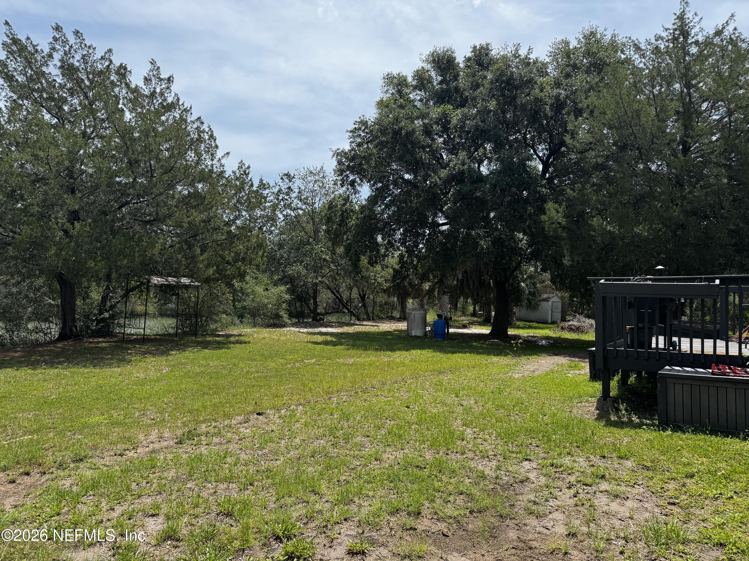 16255 Shellcracker Road Jacksonville, FL 32226 - Photo 32 of 40 a view of a swimming pool with a bench