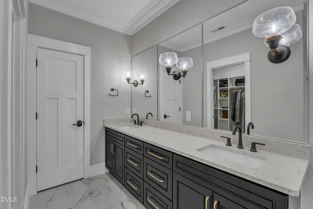 a bathroom with a double vanity sink and a mirror