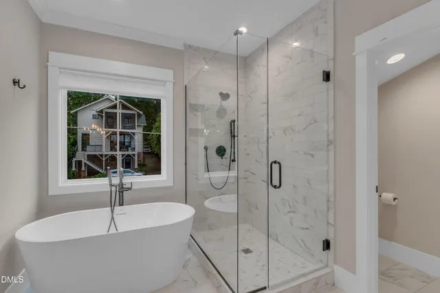 a bathroom with a bathtub and shower