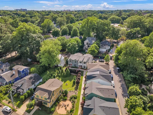 an aerial view of a house with a yard