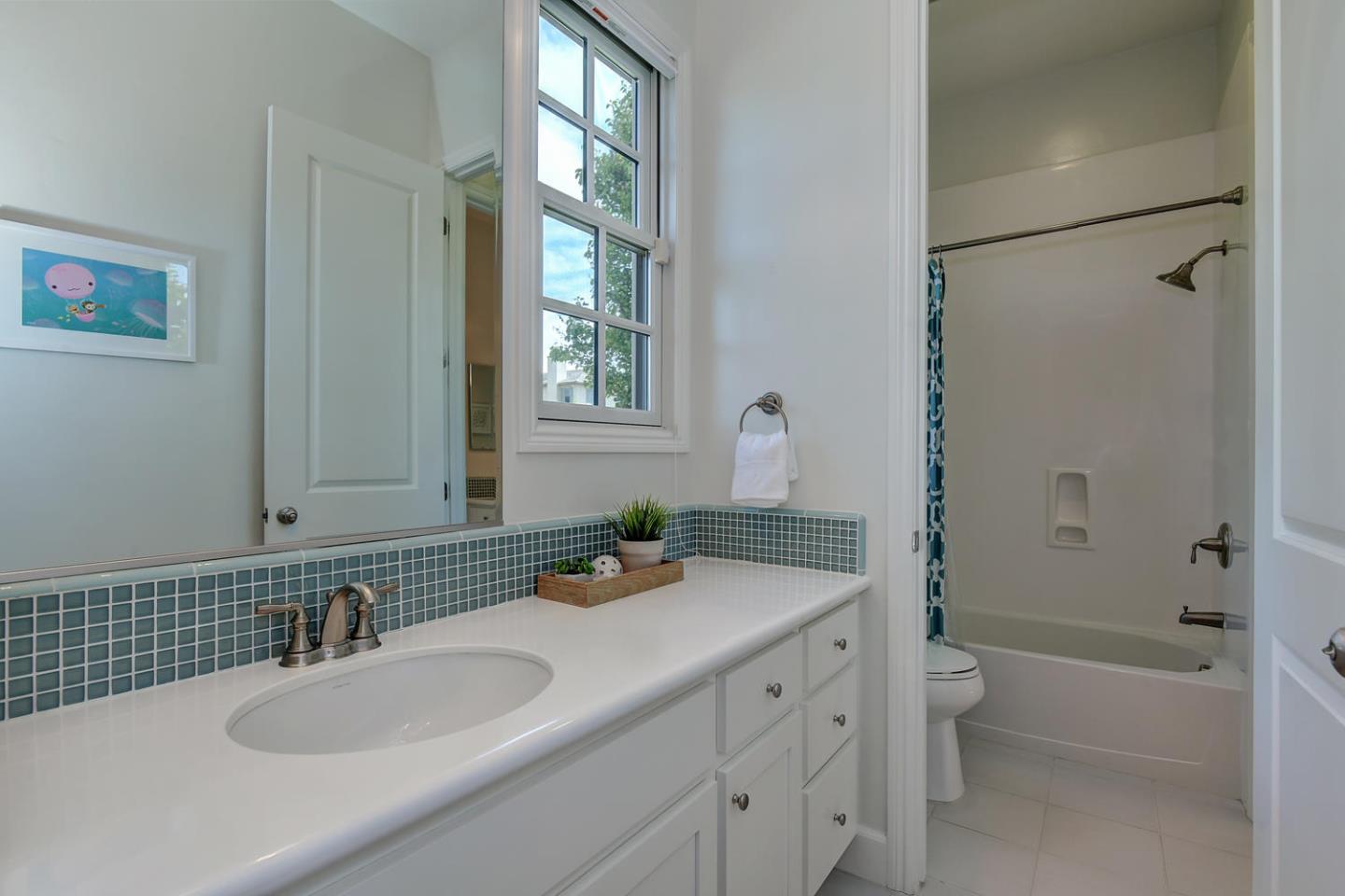 181 Mansfield Drive Mountain View, CA 94040 - Photo 25 of 44 a bathroom with a granite countertop sink a toilet and shower