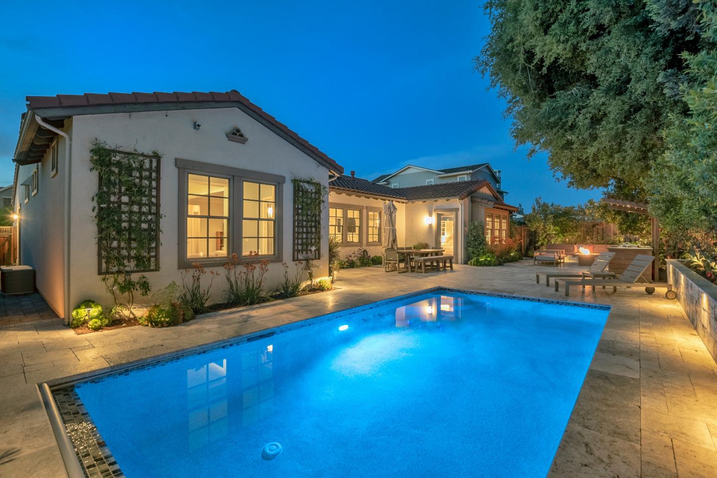 181 Mansfield Drive Mountain View, CA 94040 - Photo 38 of 44 a view of swimming pool with outdoor seating and house in the background