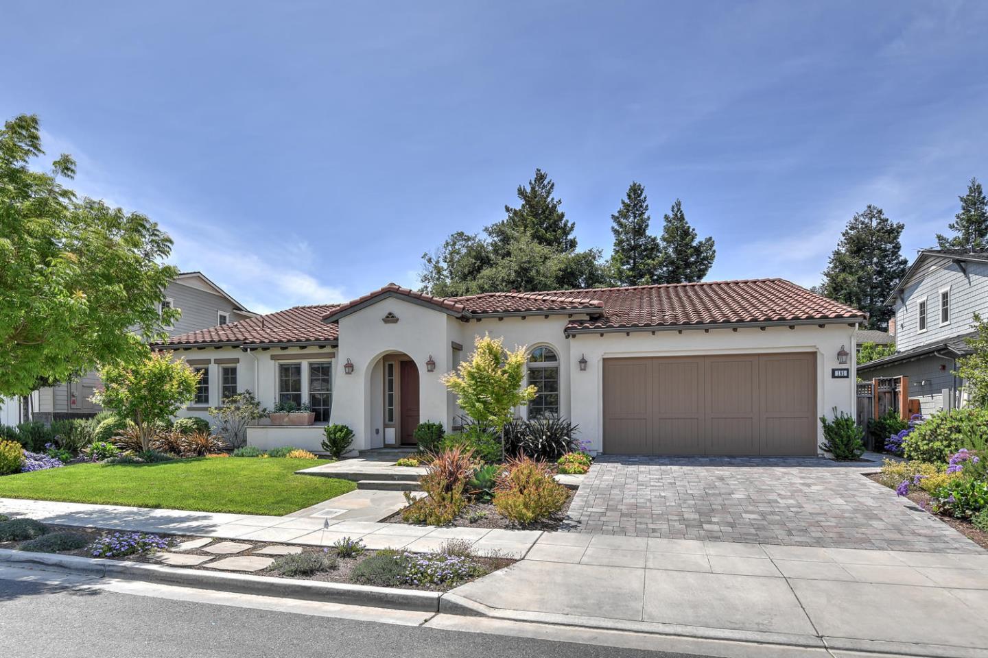 181 Mansfield Drive Mountain View, CA 94040 - Photo 4 of 44 a front view of a house with a yard and potted plants