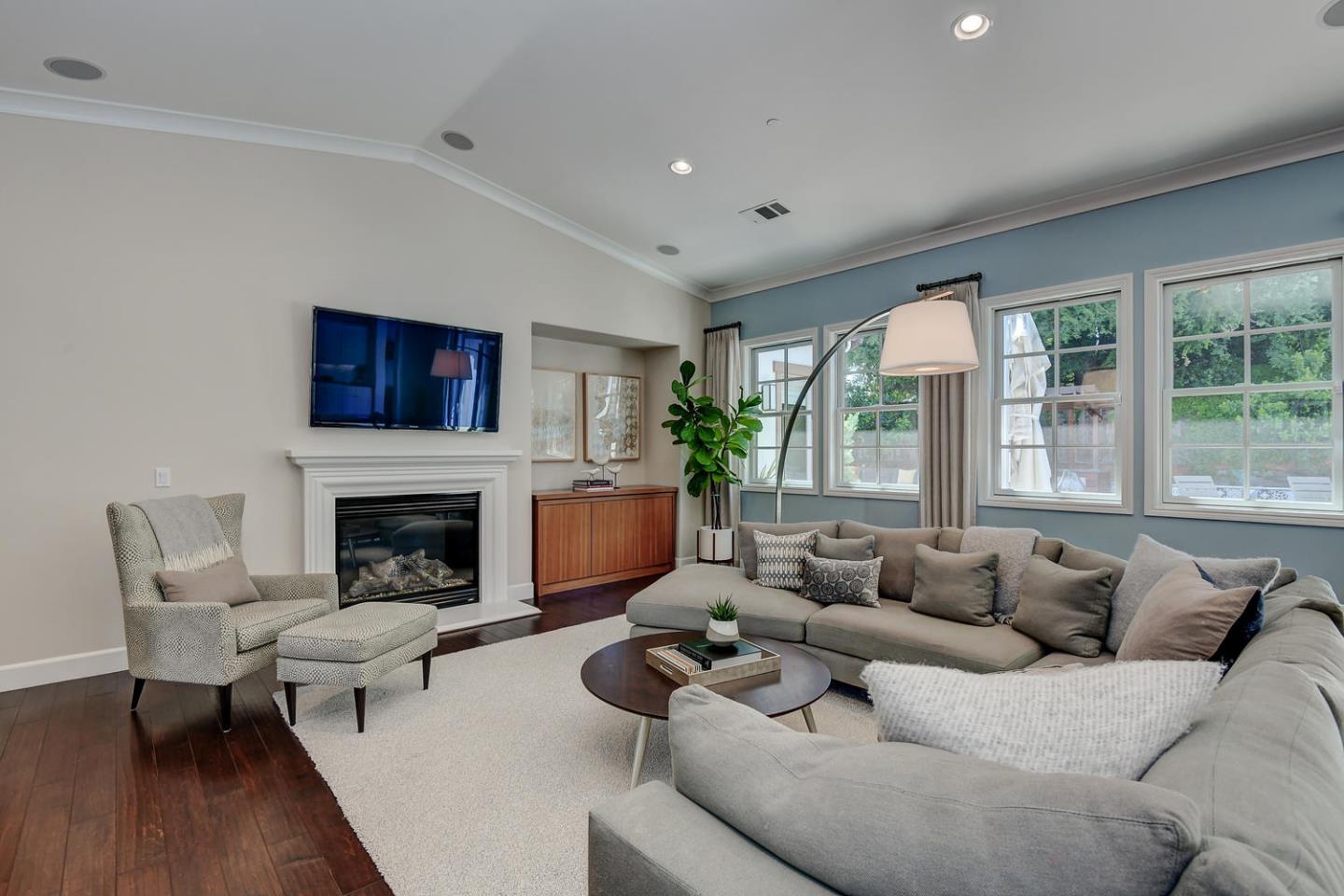 181 Mansfield Drive Mountain View, CA 94040 - Photo 6 of 44 a living room with furniture large window and a fireplace