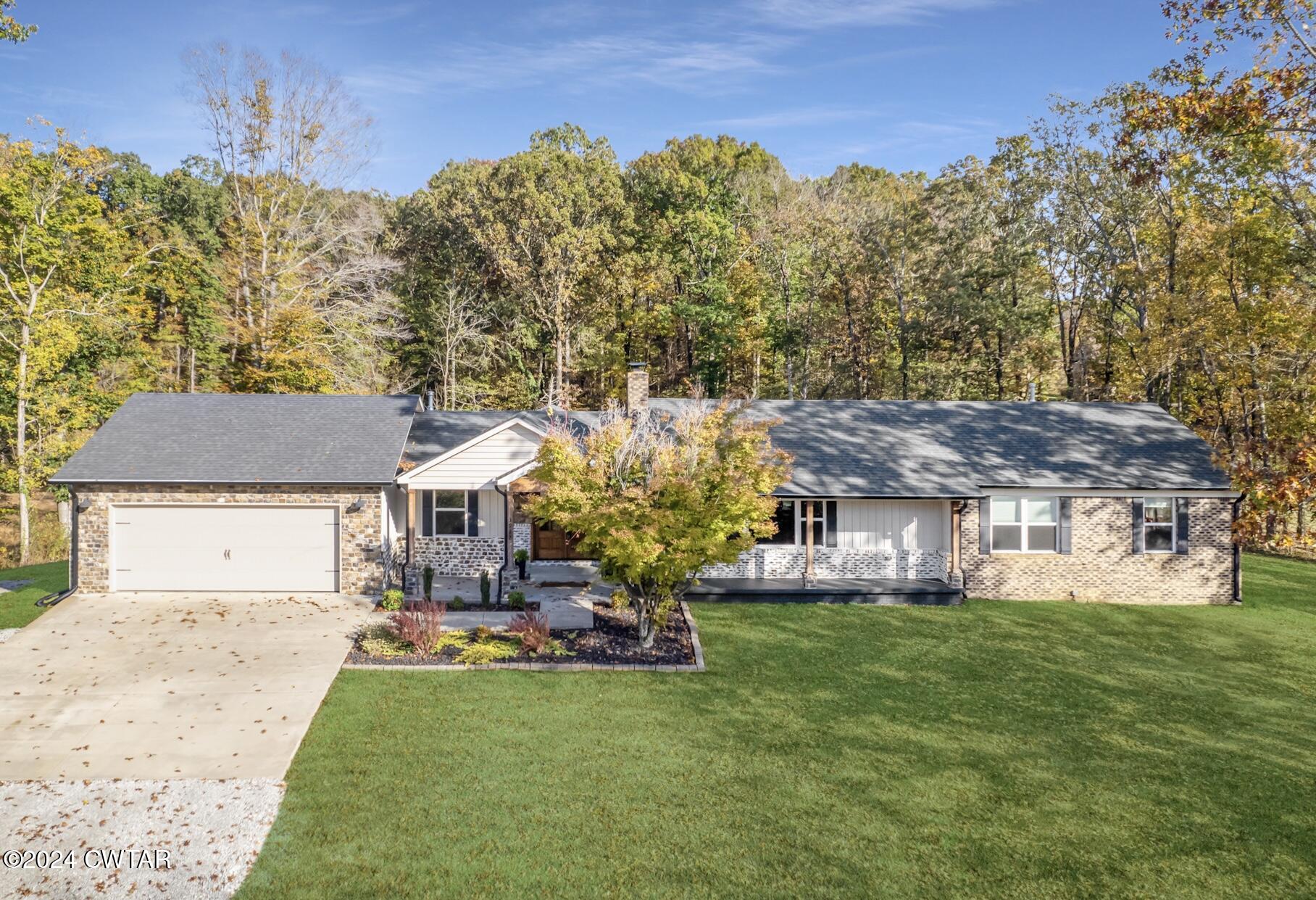 3922 Old Medina Road Medina, TN 38355 - Photo 2 of 51 a front view of a house with garden