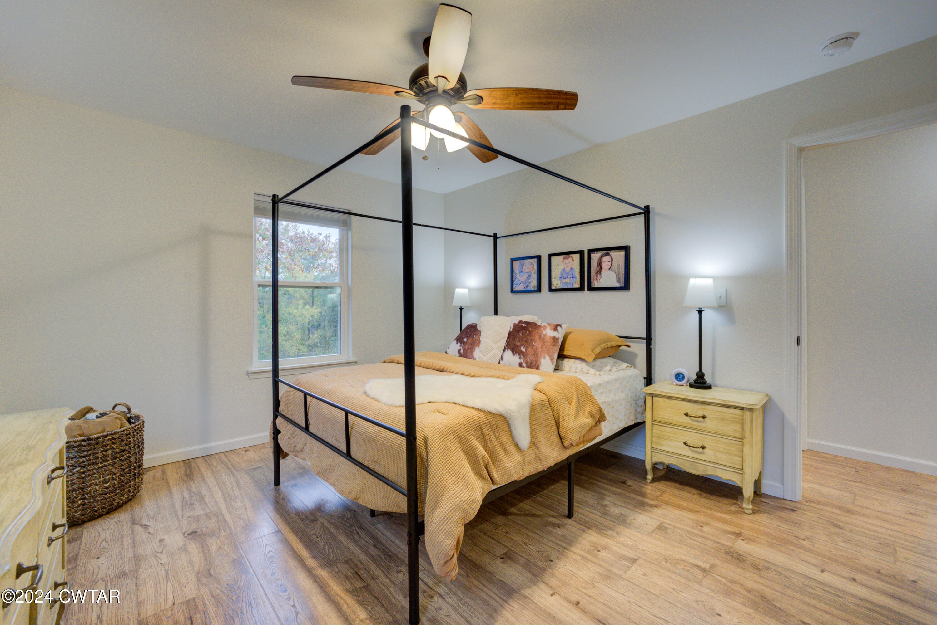 3922 Old Medina Road Medina, TN 38355 - Photo 24 of 51 a bedroom with a bed and a chandelier