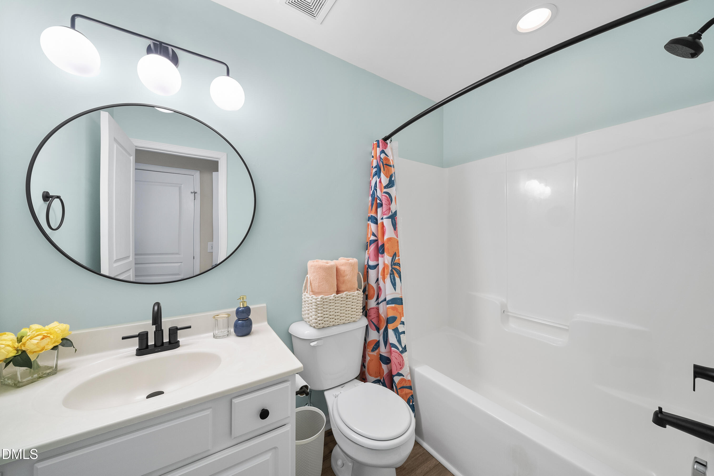 6025 History Trail Raleigh, NC 27612 - Photo 19 of 33 a bathroom with a sink a toilet and a mirror