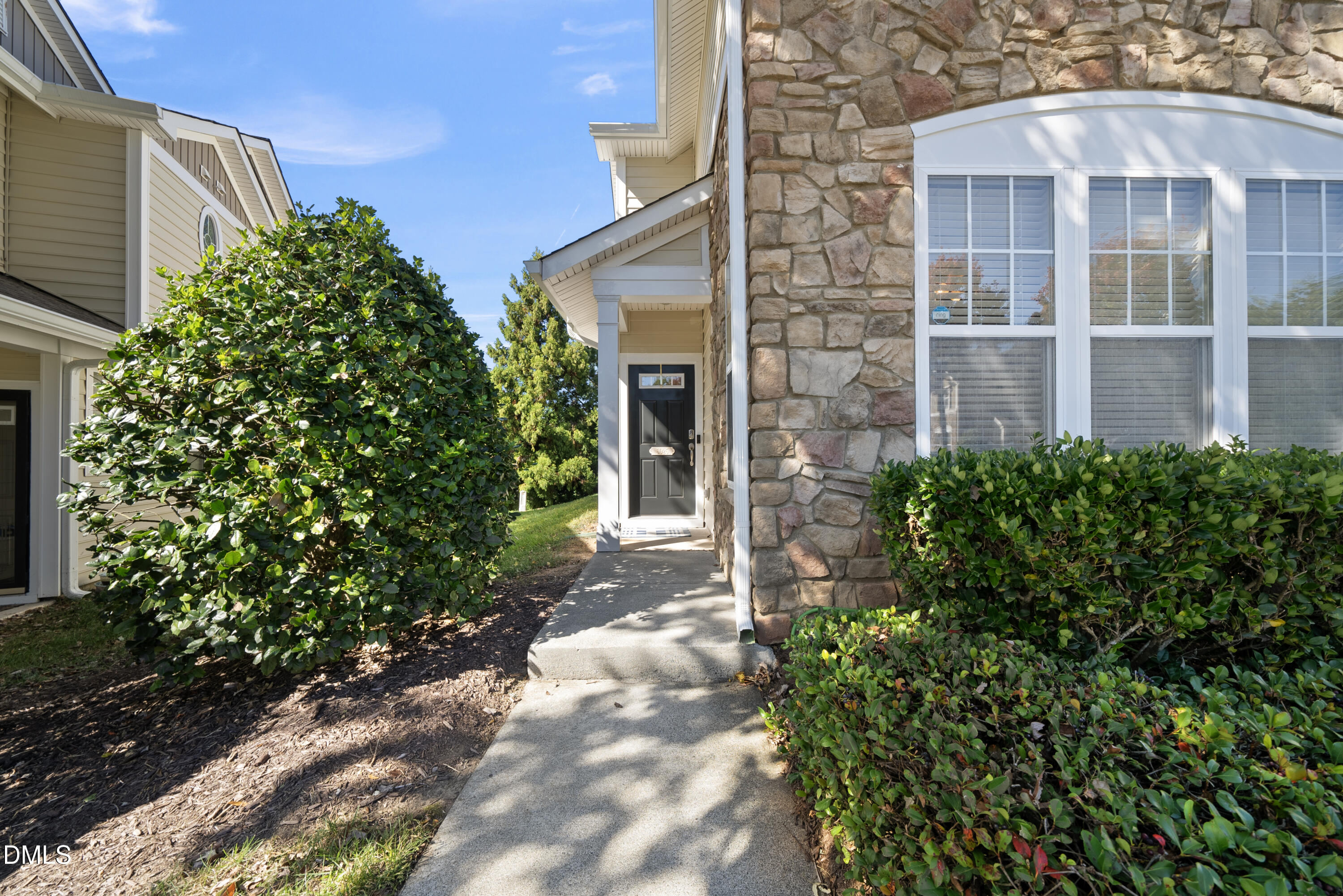 6025 History Trail Raleigh, NC 27612 - Photo 28 of 33 a front view of a house with a yard