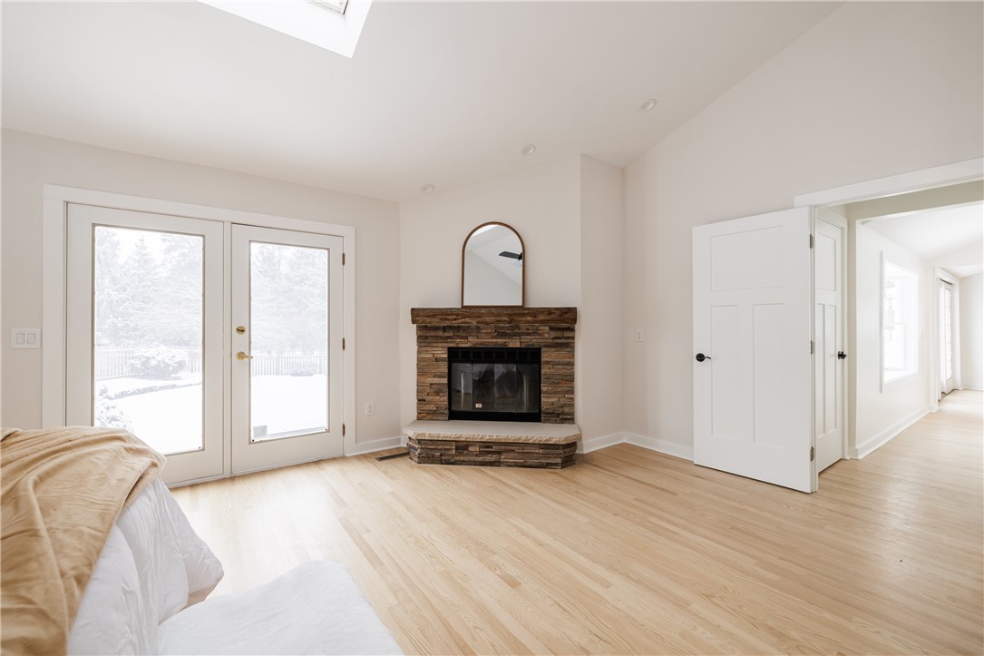 7834 N Road Victor, NY 14564 - Photo 15 of 47 Palatial First floor bedroom with wood burning fir