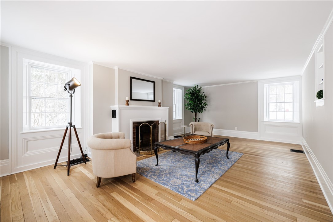 7834 N Road Victor, NY 14564 - Photo 16 of 47 Exquisite formal living room with wood burning fir