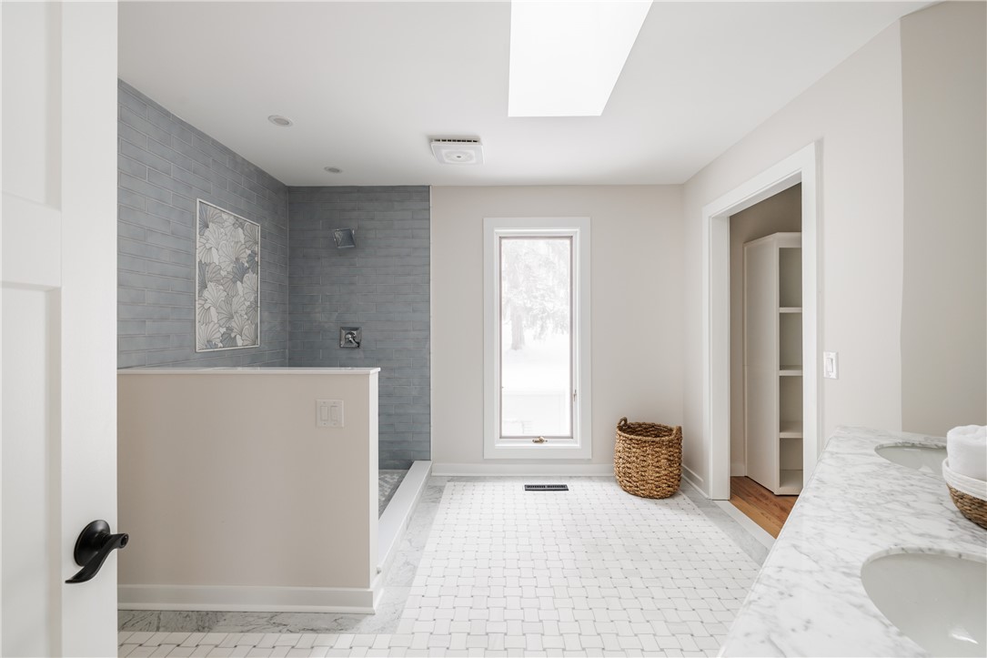 7834 N Road Victor, NY 14564 - Photo 24 of 47 Master suite bathroom with walk-in closet and stan