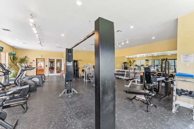 900 Bitner Road, Unit K25 Park City, UT 84098 - Photo 31 of 35 Fitness center featuring cardio and weight training equipment, mirrored wall, recessed lighting, and rubber flooring