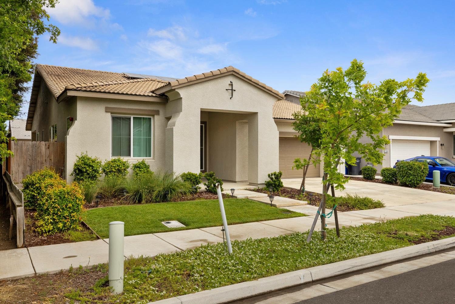 a front view of a house with garden