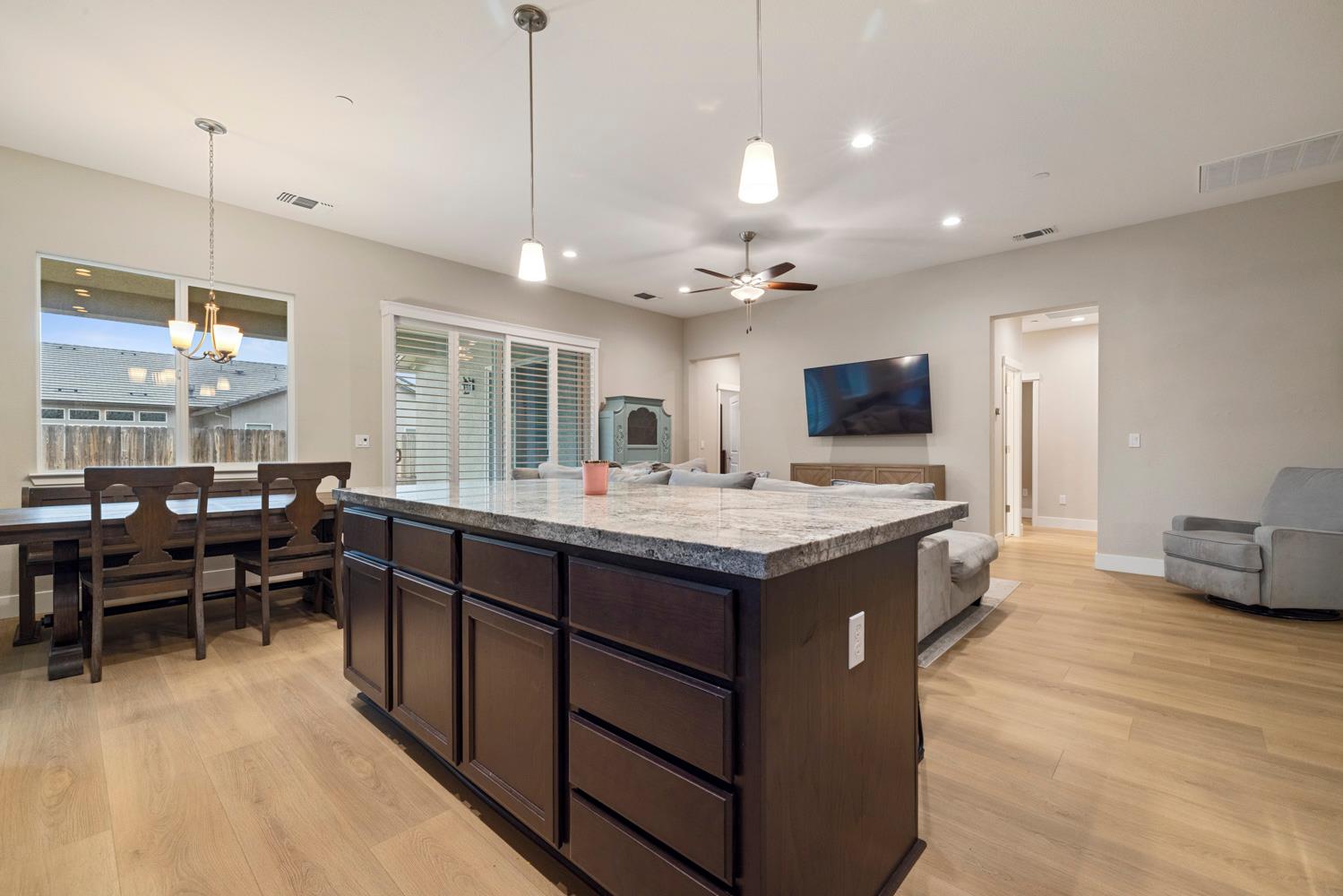 3700 Colorado Avenue Turlock, CA 95382 - Photo 15 of 46 a kitchen with granite countertop a sink a counter top space and stainless steel appliances