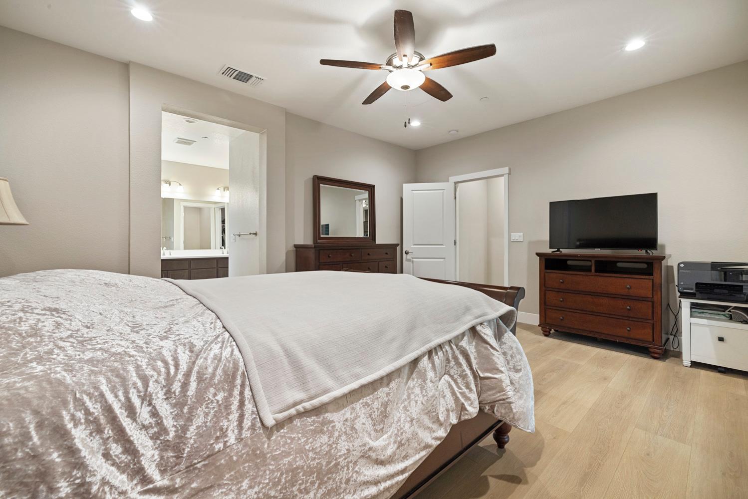 3700 Colorado Avenue Turlock, CA 95382 - Photo 19 of 46 a bedroom with a bed and a flat screen tv