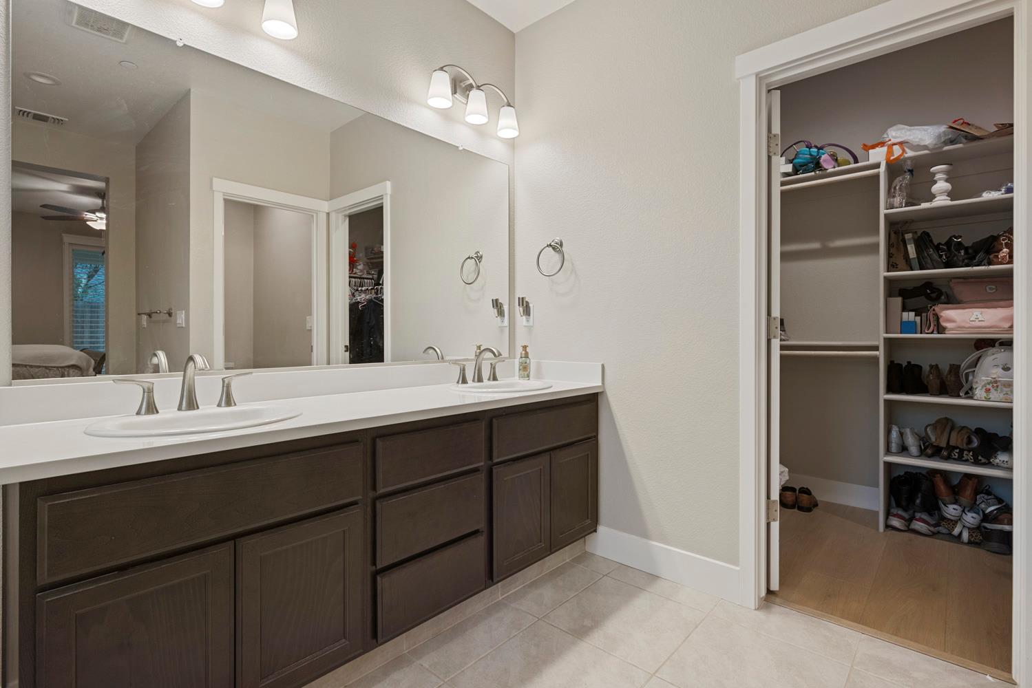 3700 Colorado Avenue Turlock, CA 95382 - Photo 21 of 46 a bathroom with a double vanity sink and a mirror