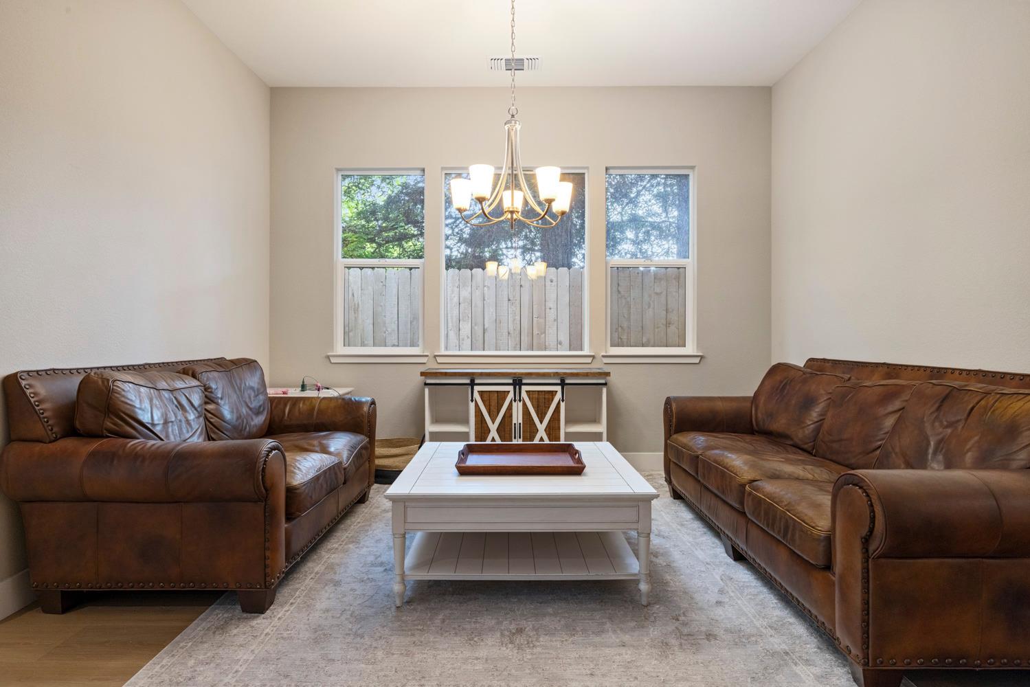 3700 Colorado Avenue Turlock, CA 95382 - Photo 9 of 46 a living room with furniture and a large window