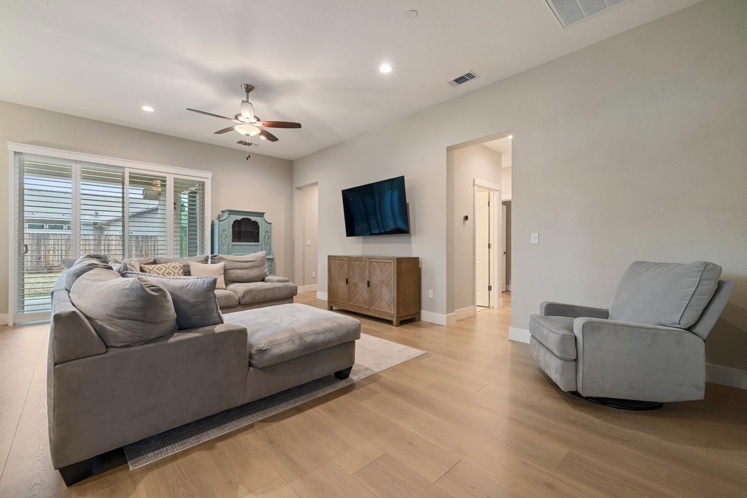 3700 Colorado Avenue Turlock, CA 95382 - Photo 10 of 46 a living room with furniture and a flat screen tv