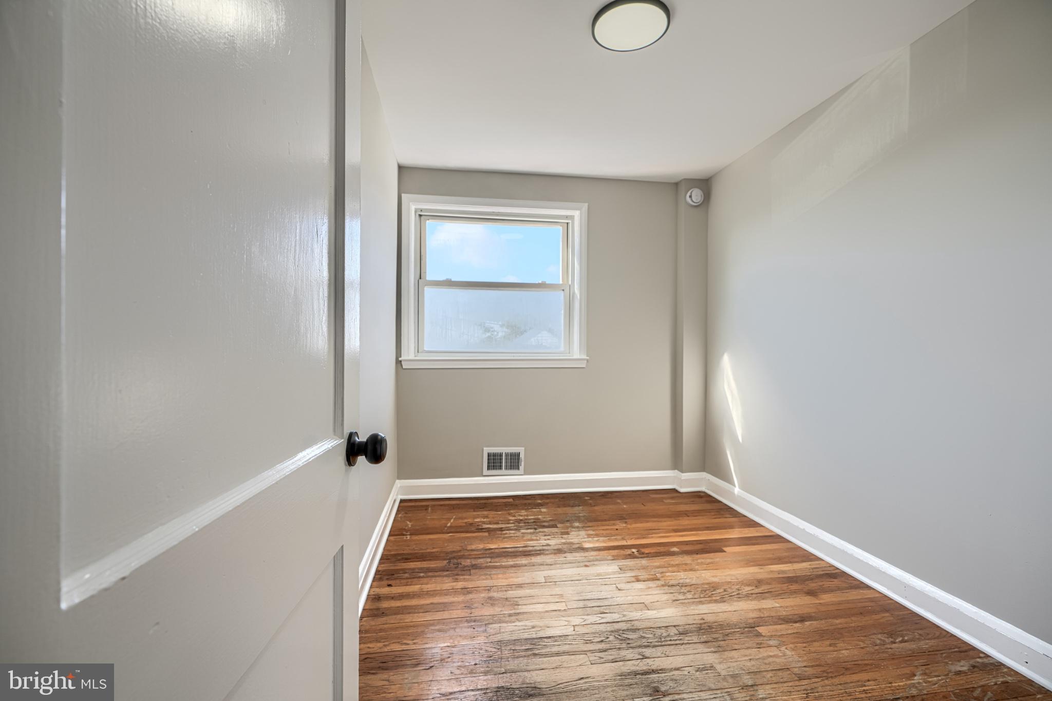 1207 Dalton Road Baltimore, MD 21234 - Photo 14 of 24 Bright and airy room with hardwood floors.