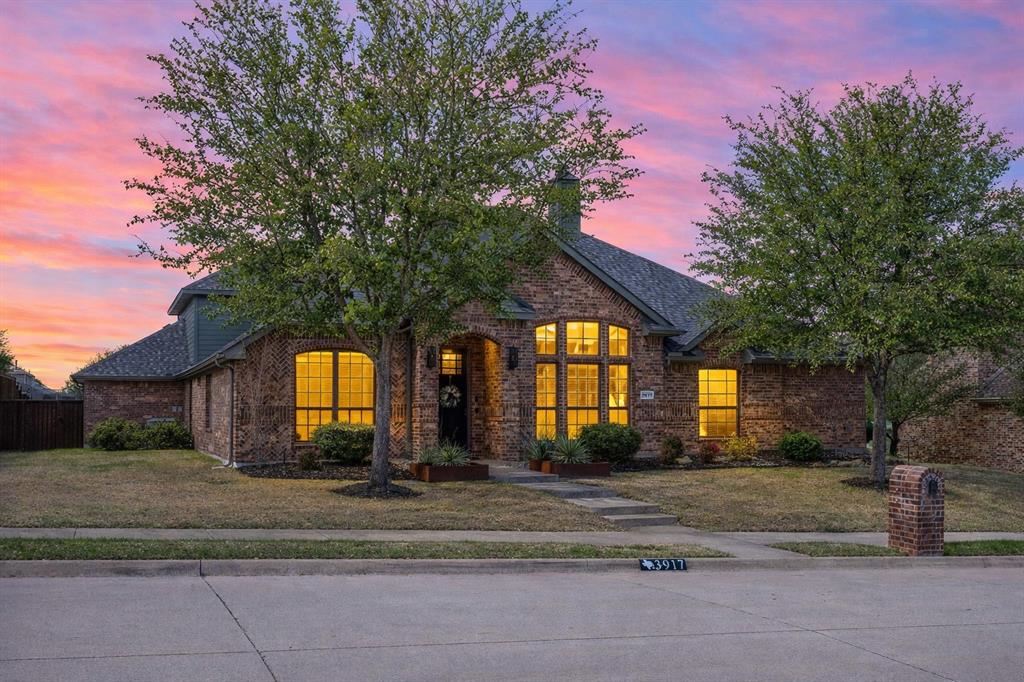 3917 Gatewick Drive Rockwall, TX 75087 - Photo 1 of 34 a front view of a house with a yard