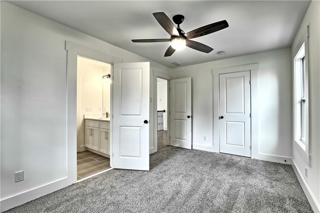 825 Beryl Street Southwest Atlanta, GA 30310 - Photo 18 of 19 an empty room with closet and windows