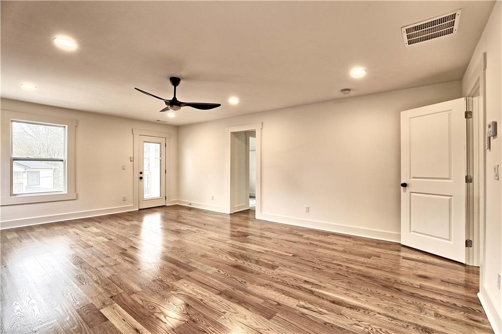 825 Beryl Street Southwest Atlanta, GA 30310 - Photo 19 of 19 a view of an empty room with a window and wooden floor