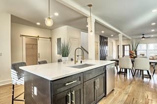 825 Beryl Street Southwest Atlanta, GA 30310 - Photo 2 of 19 a large kitchen with kitchen island a sink table and chairs