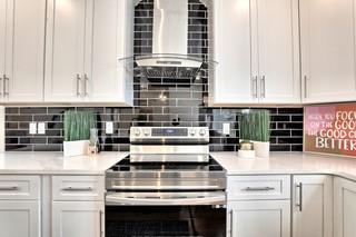 825 Beryl Street Southwest Atlanta, GA 30310 - Photo 3 of 19 a kitchen with stainless steel appliances granite countertop a stove and white cabinets