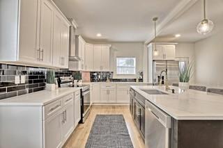 825 Beryl Street Southwest Atlanta, GA 30310 - Photo 5 of 19 a kitchen with white cabinets sink and white appliances