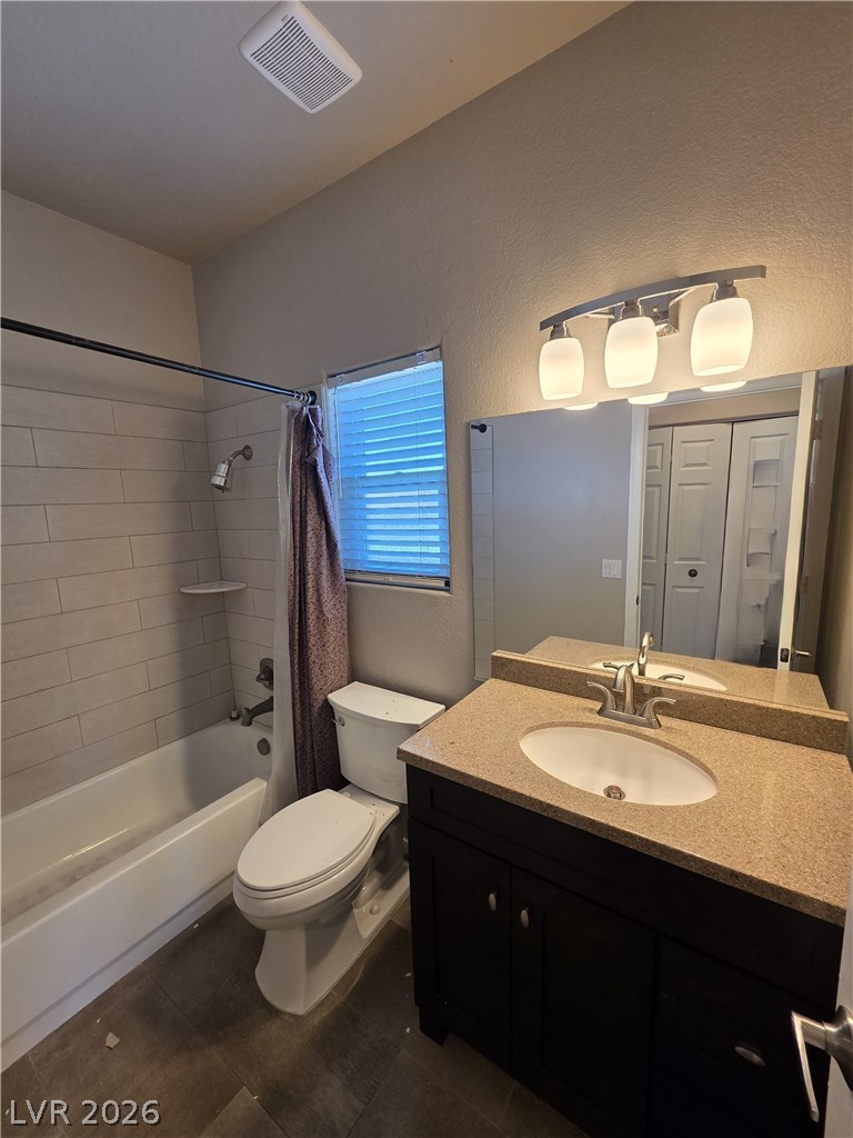 2275 Ramsgate Drive Henderson, NV 89074 - Photo 68 of 84 A well-appointed bathroom features a dark wood vanity with a granite countertop, paired with a classic tub and shower.