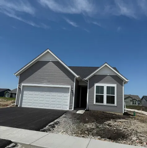 a front view of a house with yard