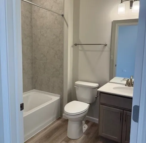 a bathroom with a sink a toilet and a bathtub