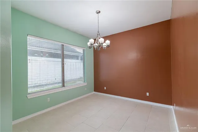 a view of a livingroom with window chandelier fan