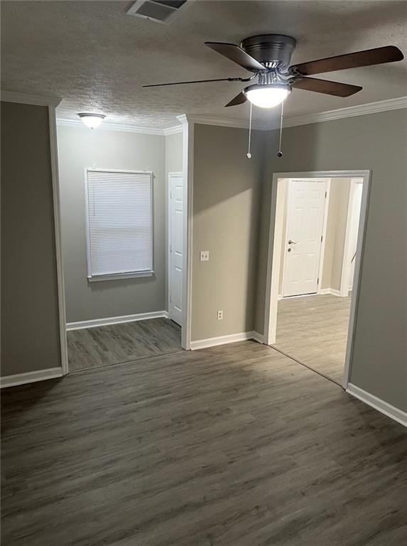 2716 Spenola Street Columbus, GA 31906 - Photo 2 of 11 a view of an empty room with wooden floor and a ceiling fan