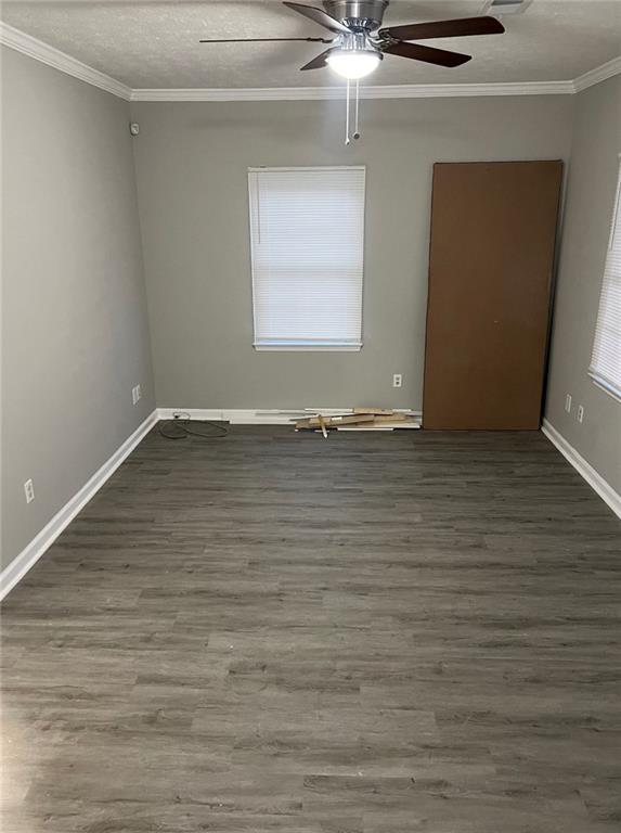 2716 Spenola Street Columbus, GA 31906 - Photo 4 of 11 a view of an empty room with wooden floor and a window