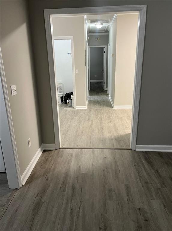 2716 Spenola Street Columbus, GA 31906 - Photo 5 of 11 an empty room with wooden floor and entrance